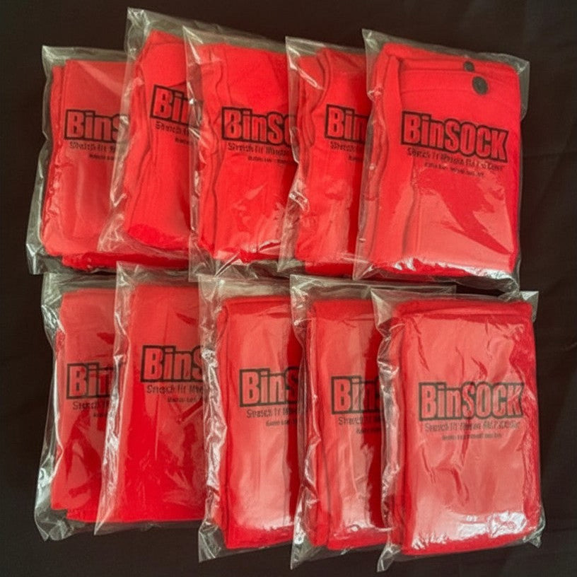 Red bags labeled 'Binsock' in clear plastic packaging on a dark background