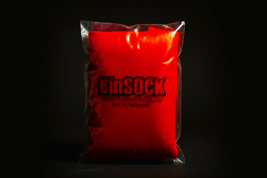 A red Binsock stretch‑fit cover sealed over a wheelie bin lid, showing how it blocks flies and helps prevent maggots.